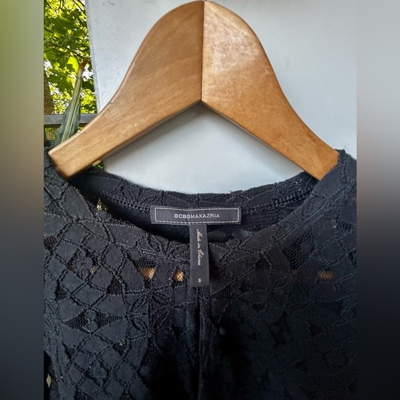 BCBG MaxAzria black lace crop top.Has a split in chest area.Very stretchy.Size S - Picture 2 of 4
